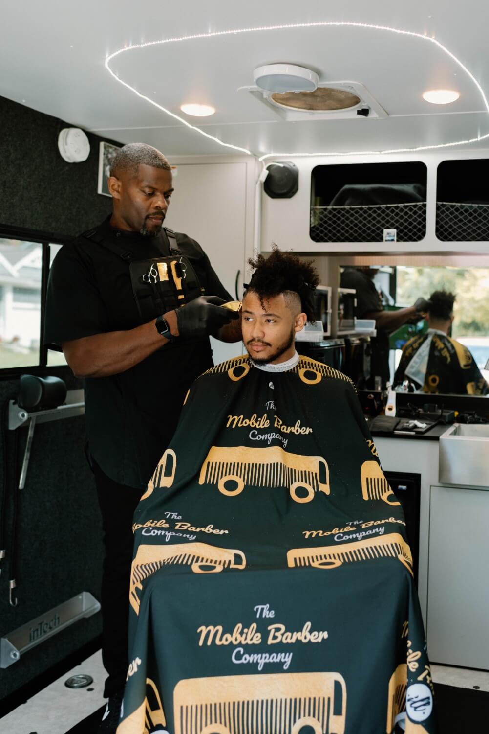 the mobile barber company at work